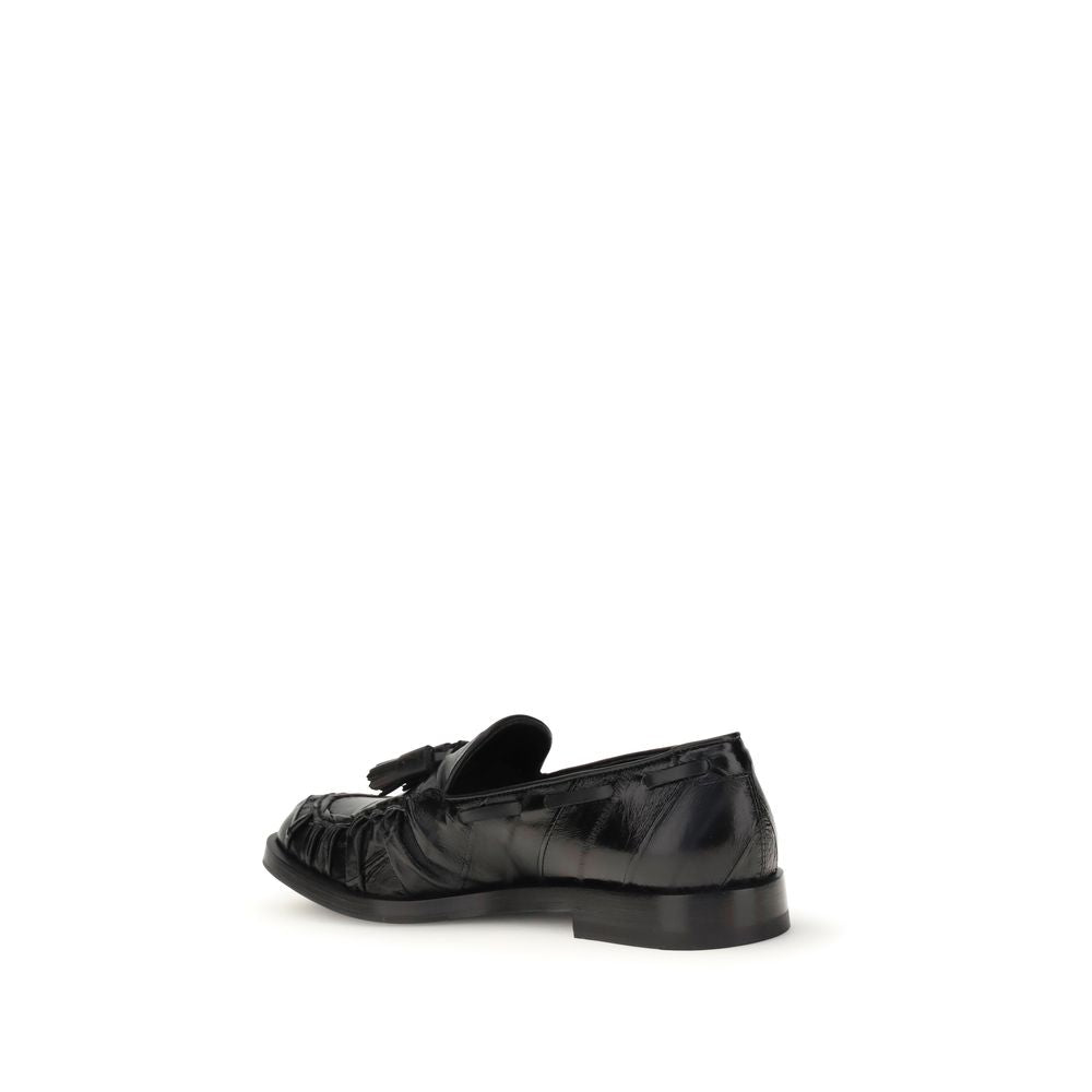 Fratelli Rossetti Black Rubber Slip-On Loafers with tassels, side view showcasing leather upper and rubber sole, ideal for smart-casual wear.