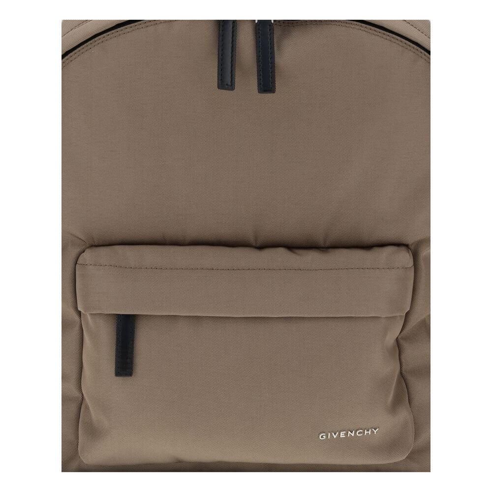 Givenchy Brown Polyamide Backpack with metal logo, front zip pocket, and leather pull tabs. Modern and practical design for everyday use.