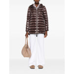 Herno Coats Brown - chocolate brown midi down jacket with two-way zip, high-shine finish, and drawstring hood, styled with white pants.