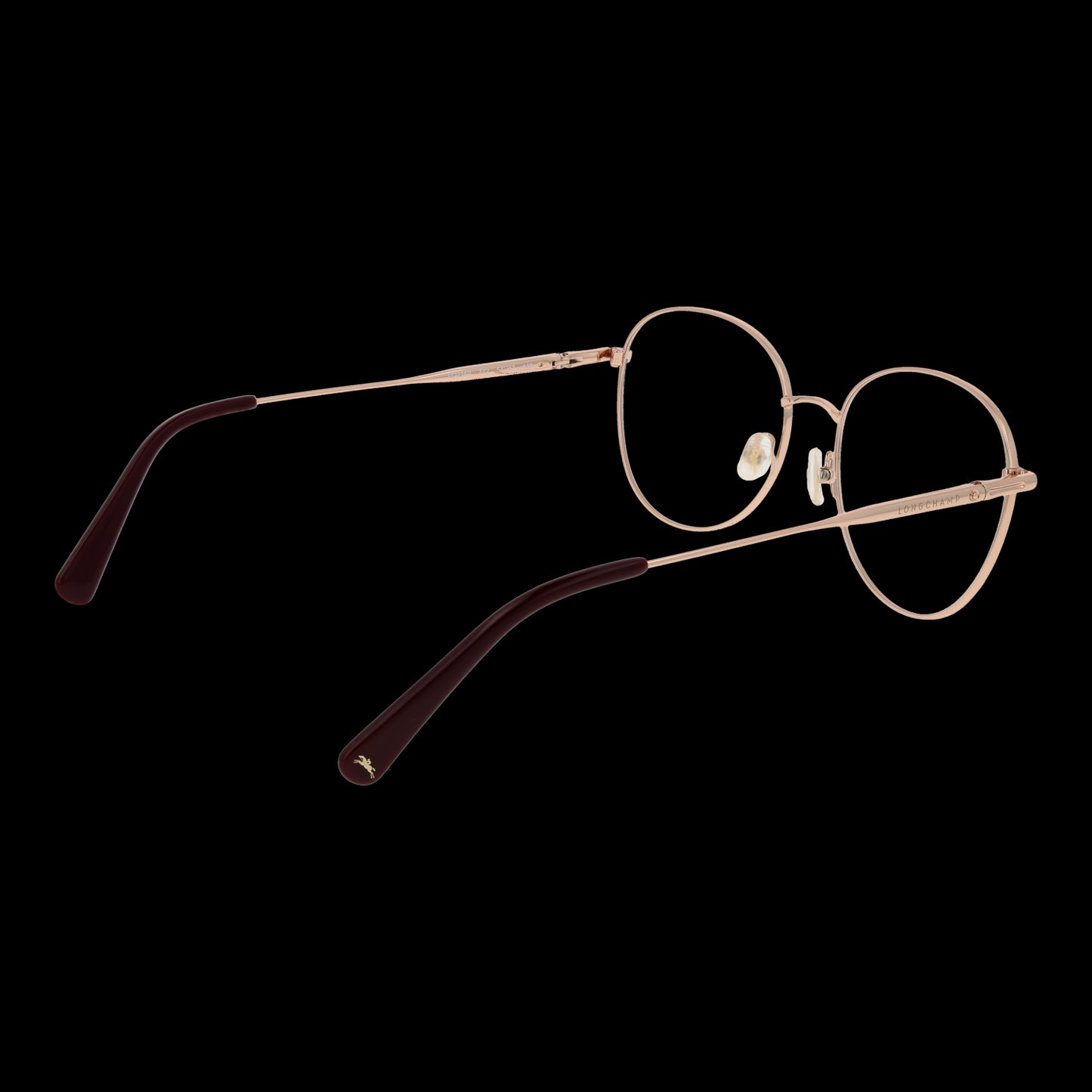 Lady's eyeglasses LONGCHAMP MOD. LO2140 54772 in gold thin frame, side view showing design and style, against a black background.