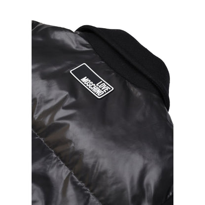 Close-up of Love Moschino Black Polyester Clothing puffer jacket with logo patch.