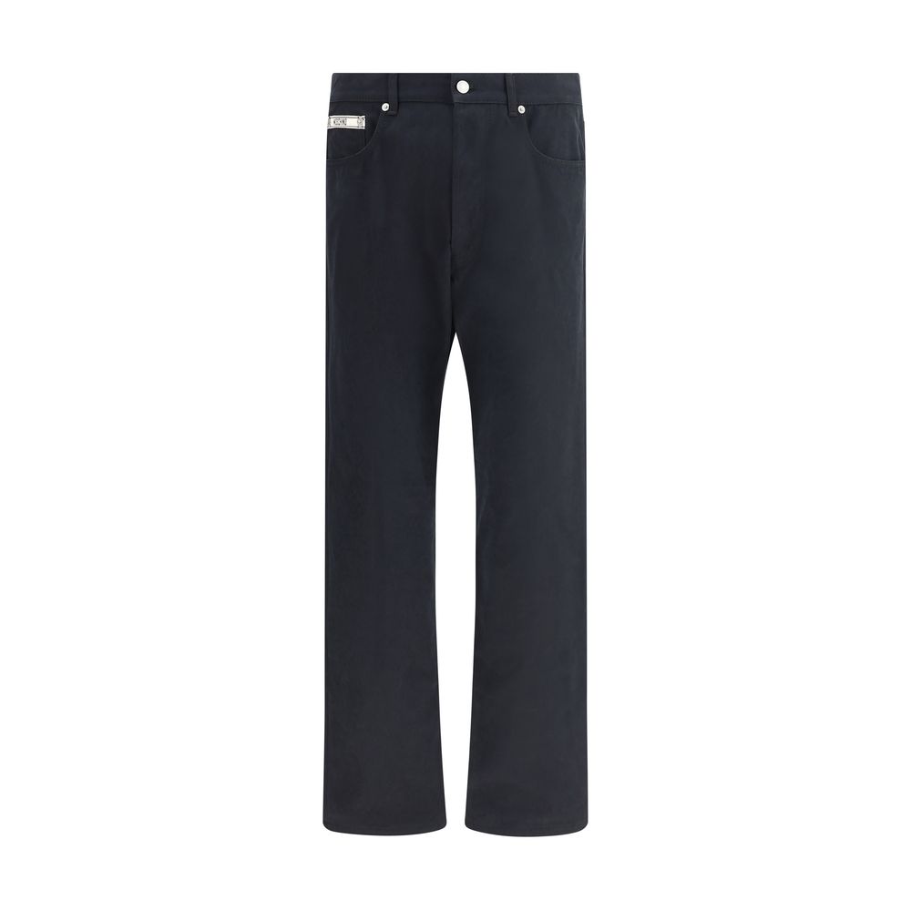 Moschino Black Cotton Casual Pants with straight-leg cut, five-pocket style, zip closure, and signature patch, 100% cotton.