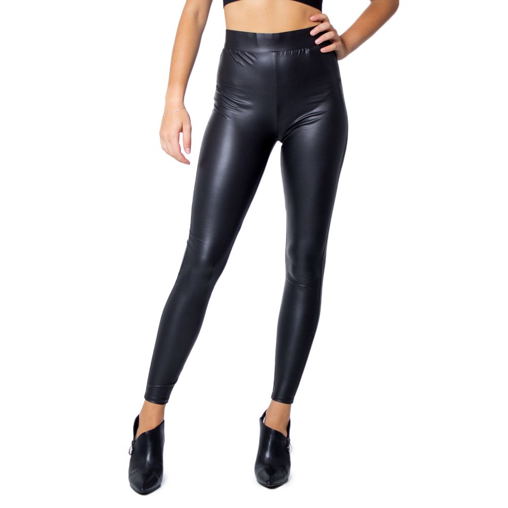 Woman wearing Only Black Polyester Leggings with glossy finish and fitted design, ideal for stylish casual or sophisticated evenings.