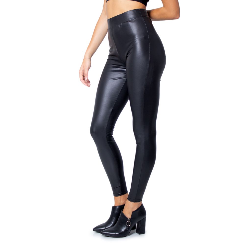 Woman wearing Only Black Polyester Leggings with a glossy finish, showcasing fitted design and stretchy fabric for stylish comfort.