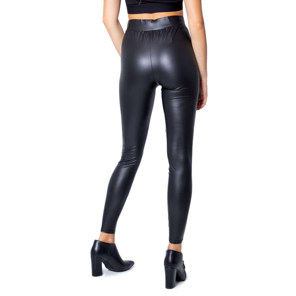 Woman wearing Only Black Polyester Leggings with glossy finish, showcasing fitted and stylish design, suitable for various occasions.