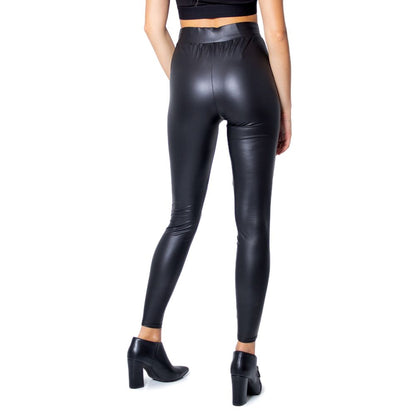 Woman wearing Only Black Polyester Leggings with glossy finish, showcasing fitted and stylish design, suitable for various occasions.
