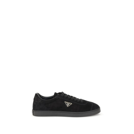 Prada Black Calf Leather Bos Taurus Low Top Sneakers with iconic triangular plaque and tone-on-tone logo; rubber sole.