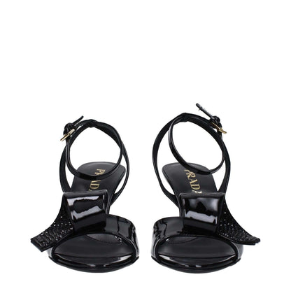 Prada Black Leather Stiletto Heel Sandals with open toe and buckle closure, patent leather, mid heels, and side detail design.