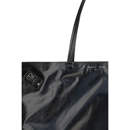 Close-up of Proenza Schouler Black Leather Shoulder Bag with silver-tone side buckle and glossy finish.