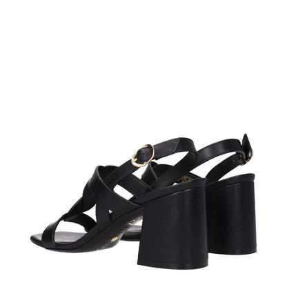 Stuart Weitzman Black Leather Platform Sandals with mid heels, open toe, and buckle closure shown from the back angle.