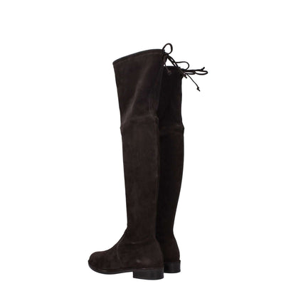 Stuart Weitzman Brown Leather Over The Knee boots, side view showing suede material, low flat heel, and self-tie closure.
