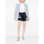 Model wearing navy blue Tom Ford Shorts Blue with logo waistband and a light blazer, perfect for a chic casual outing.
