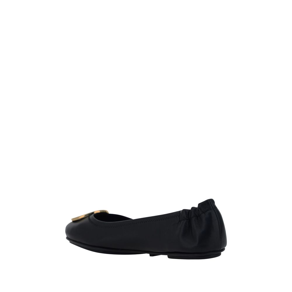 Tory Burch Black Lamb Ovis Aries Aries Ballet Flats, side view with embossed monogram plaque and logo-embossed insole for comfort.