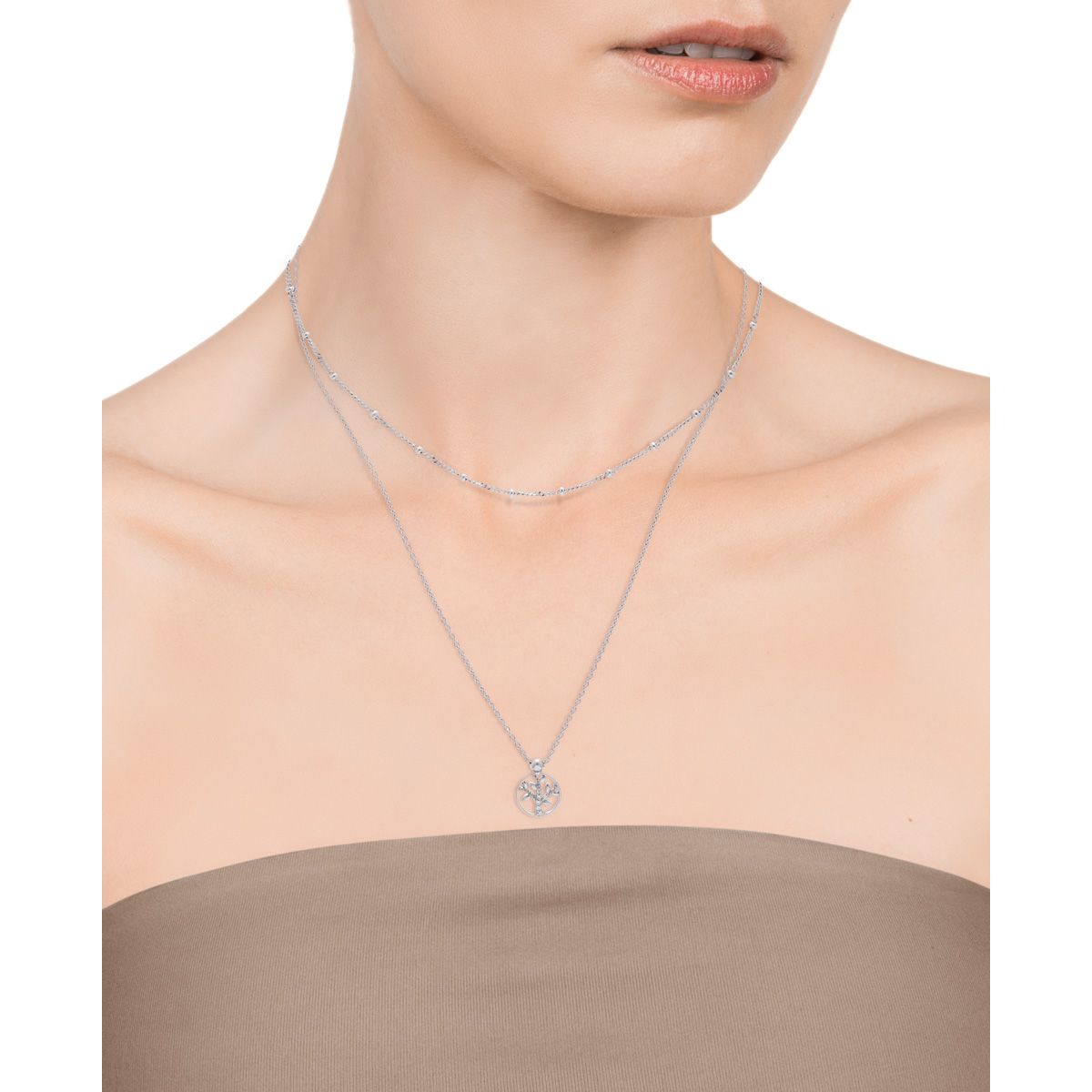 Lady wearing VICEROY JEWELS Mod. 4104C000-38 silver necklace with quartz chronograph on beige strapless dress. Elegant fashion jewelry.