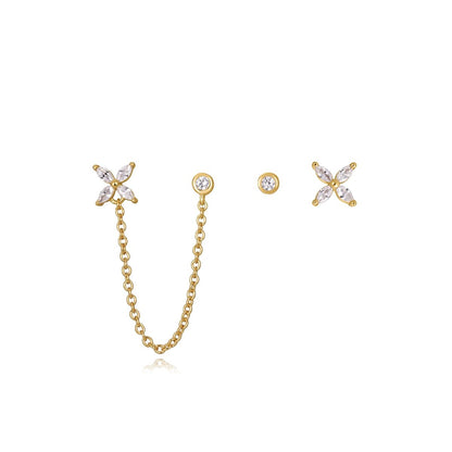 Gold star and chain earrings with crystal accents.