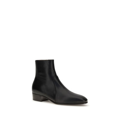 Valentino Garavani Black Goatskin Ankle Boots with brass VLogo, elegant kid leather design for AW25 collection, side profile view.