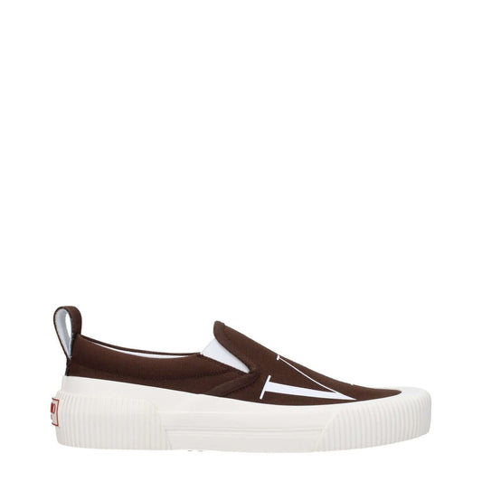Valentino Garavani Brown Fabric Slip-On Loafers, featuring a front and back logo, round toe, rubber sole, low flat heel, and dark chocolate accents.