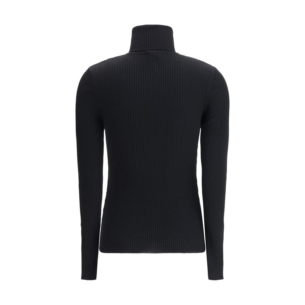 Back view of Wolford Black Fleece Wool Turtleneck with ribbed design and slim fit silhouette, showcasing elegant long sleeves and turn-up collar.